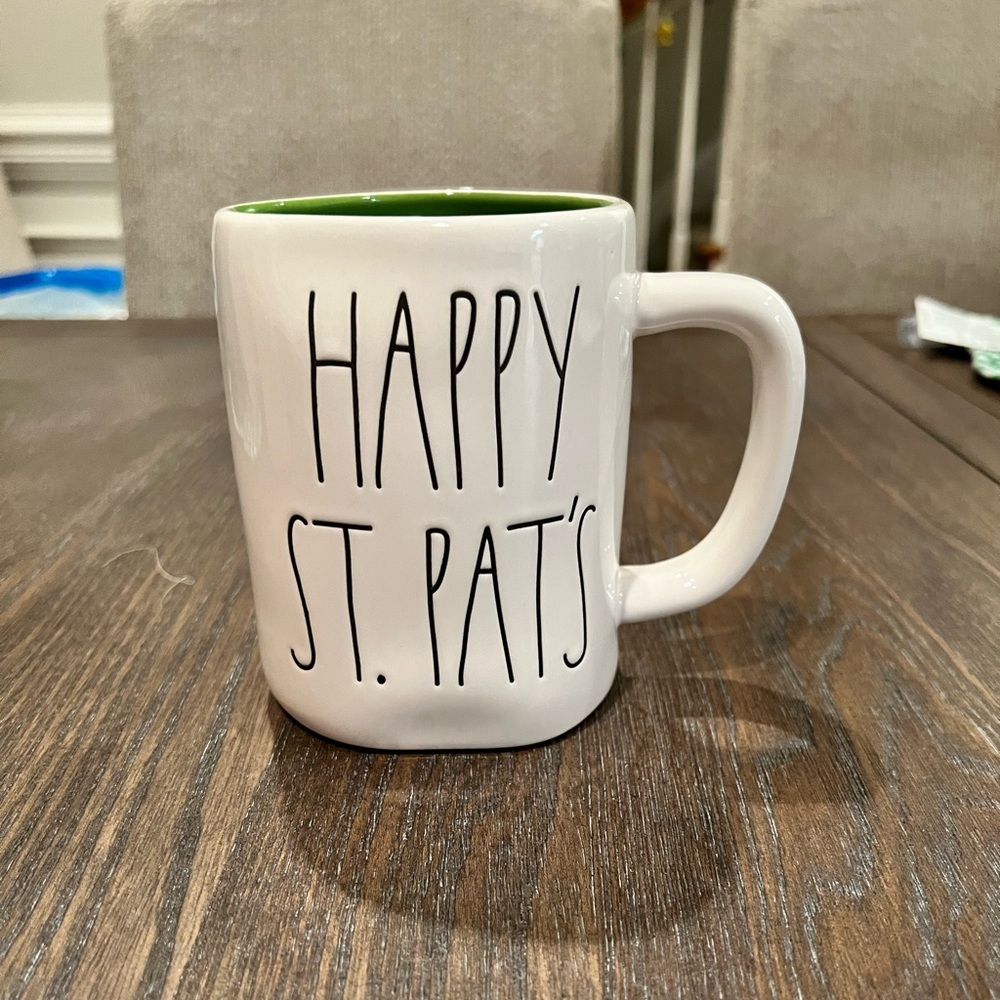 NEW! Rae Dunn coffee mug “Happy St.Pats” with a shamrock on the other side.